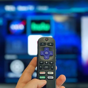 Hulu on Roku TV with a Roku remote and the dedicated Hulu button.